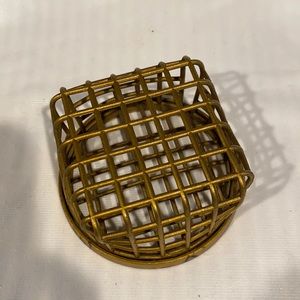 Vintage metal flower holder stamped “Dazey”4 in wide by 2 in tall.